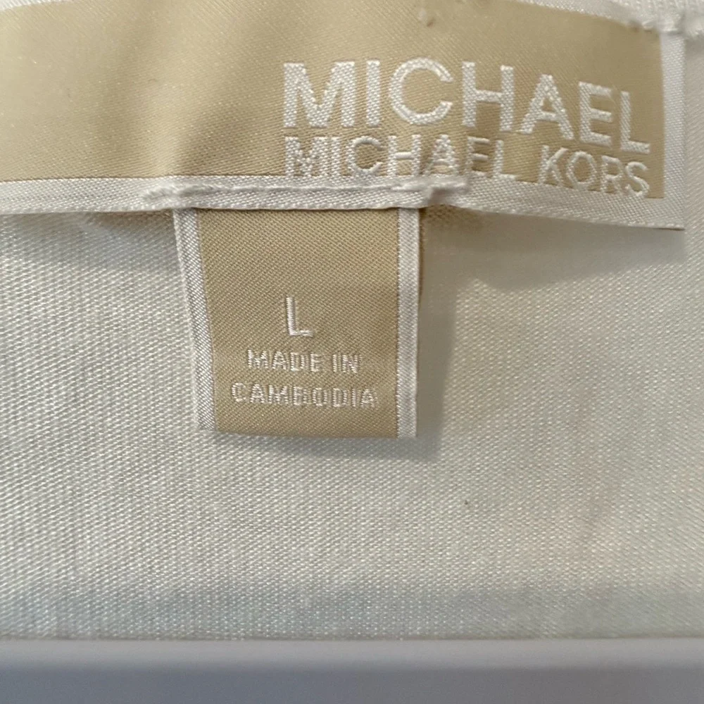 Michael Kors women’s Large sleeveless V-neck blouse with an asymmetrical hem